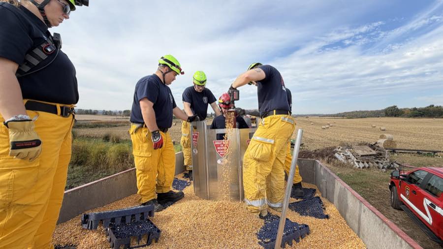 District personnel practicing grain-bin and silo rescue using a grain rescue tube.
