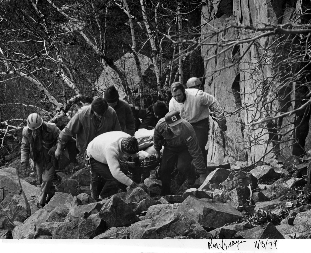 Responders carrying a patient through rocky terrain at Devil’s Lake in 1979.