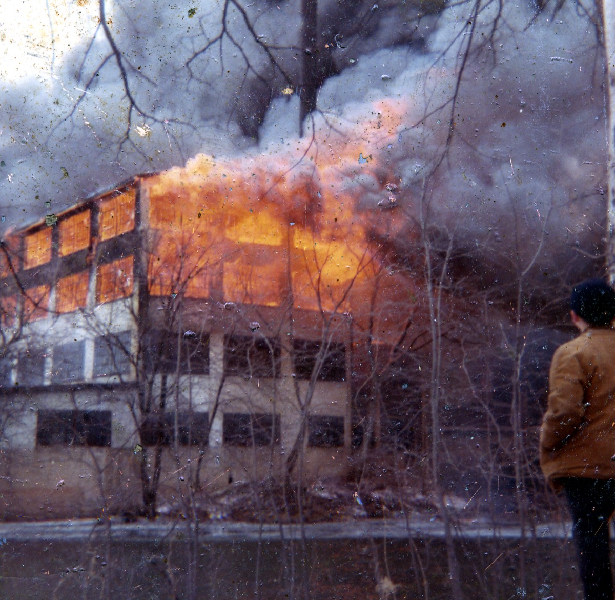 Flames and smoke rising from the Island Woolen Mill in 1969.