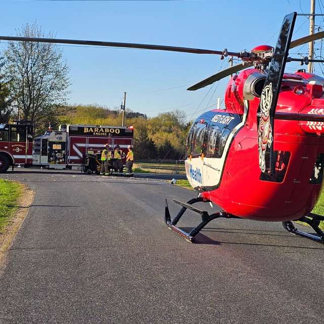UW Health Med Flight helicopter staged with Baraboo Engine 3 and District personnel.